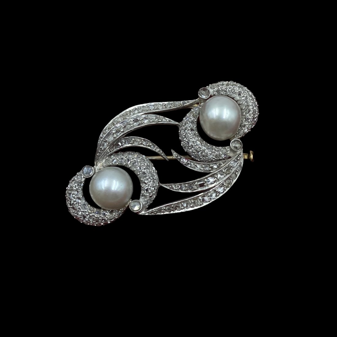 18K Edwardian Rose Cut Diamond Pearl Brooch: Elegant antique brooch featuring two large pearls measuring 9mm each encircled by apx 1.5 CTW rose cut diamonds. Measures 50mm W x 30mm T. Weight 10.7g. Excellent condition.