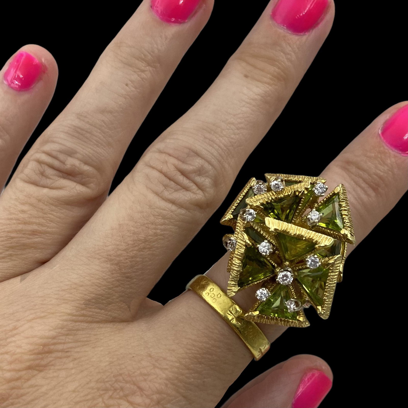 18K 1970s Geometric Peridot Diamond Ring: Geometric overlapping Flowers with triangular Peridot panels and diamond accents. Apx 1 CTW diamonds. Sits 14mm high on the finger and measures approx 29mm North to South, 28mm East to West. Size 6-1/