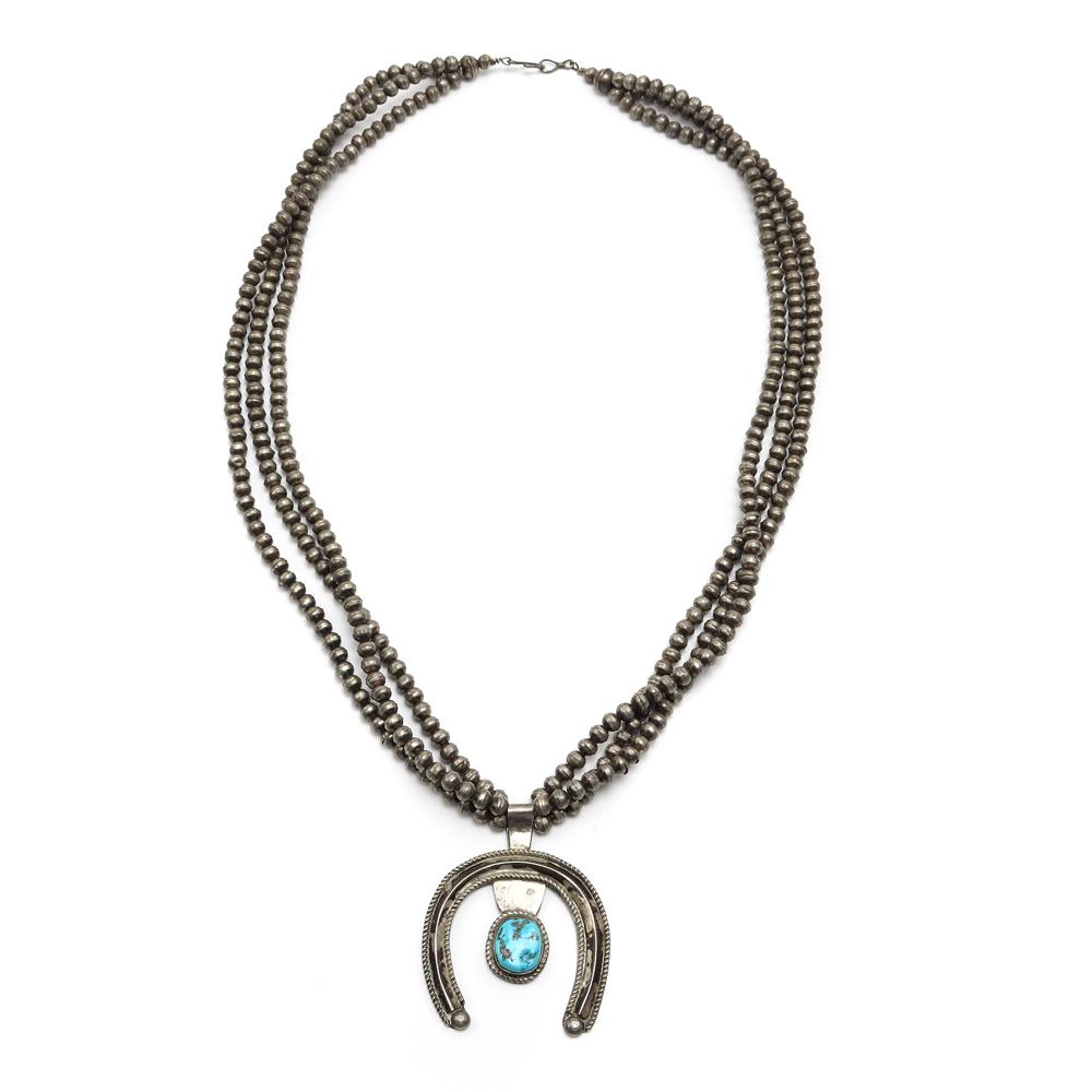 Navajo Turquoise and Silver Beaded Necklace Naja: Navajo 3-Strand Turquoise and Silver Beaded Necklace with Naja Pendant c. 1960s. 98.6g, 30" length, 2.75" x 2.25" naja. Hallmarked JW. Possibly by Jerry William or Juliana Williams. Acquired from a pr