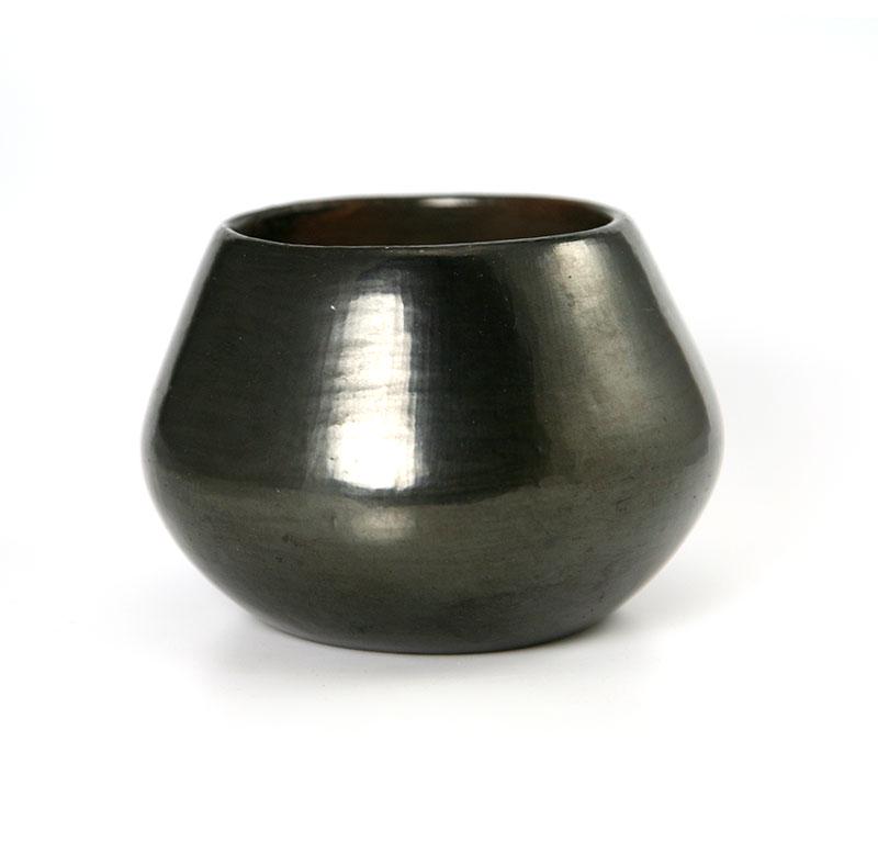 Carmelita Dunlap (1925-1999) - San Ildefonso Black Jar: Carmelita Dunlap (1925-1999) - San Ildefonso Black Jar c. 1980s. Beautiful, simple black jar. Highly polished, smooth surface. This jar was fired outside using the oxygen reduction process. Signed "Ca
