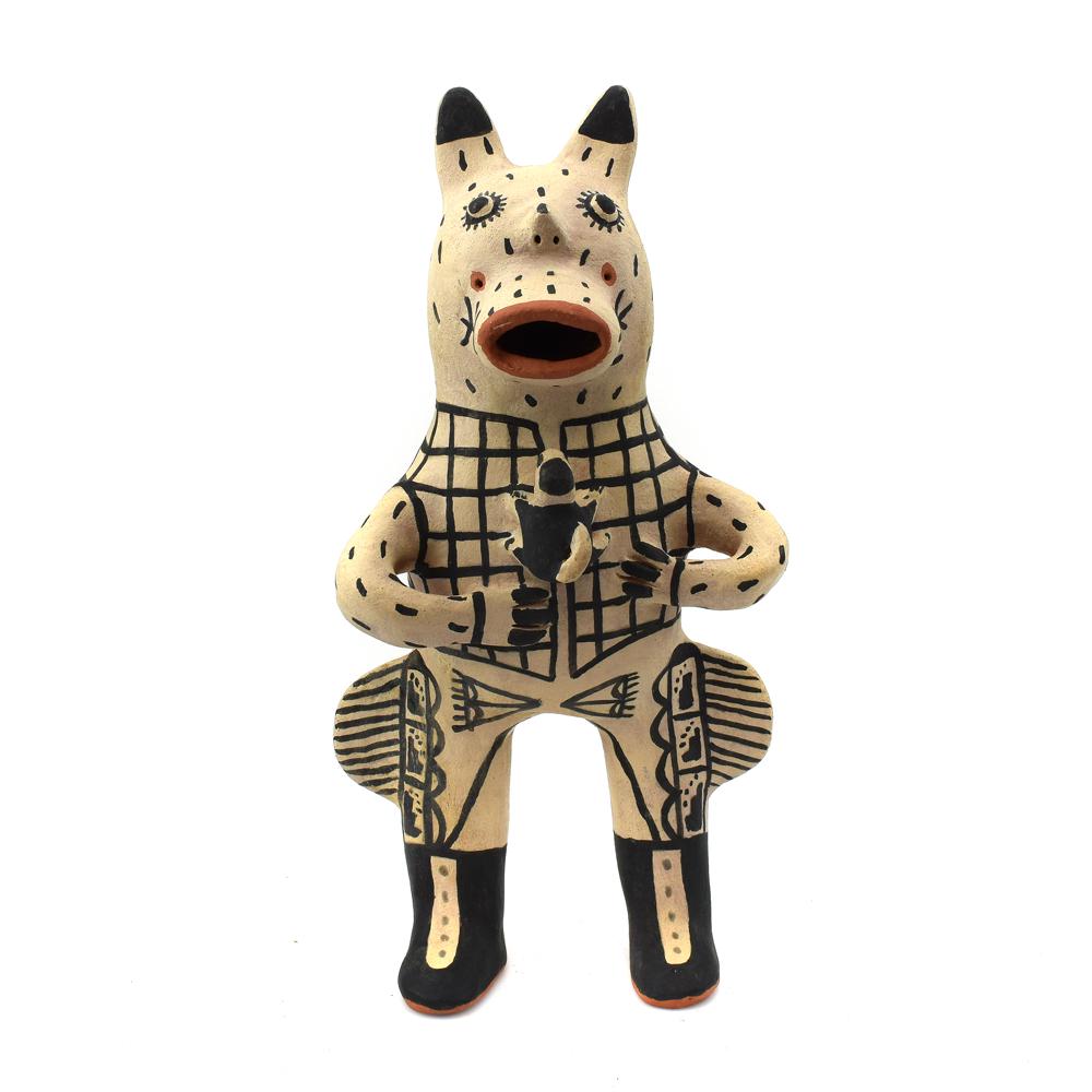 Martha Arquero - Cochiti Storyteller Figurine c. 1970s: Martha Arquero (b. 1944) - Cochiti Storyteller Figurine c. 1970s. Coyote cowboy storyteller with baby coyote and black design on white Cochiti slip. Acquired from a private collection in Washington.