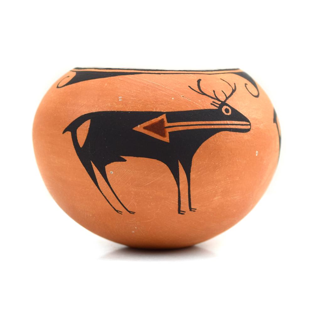 Emma Lewis - Acoma Heartline Deer Jar c. 1970-80s: Emma Lewis (1931-2013) - Acoma Heartline Deer Jar c. 1970-80s. Emma Lewis was the daughter of the famous potter Lucy Lewis. This jar has a red slip over Acoma clay, and three black deer each with a re