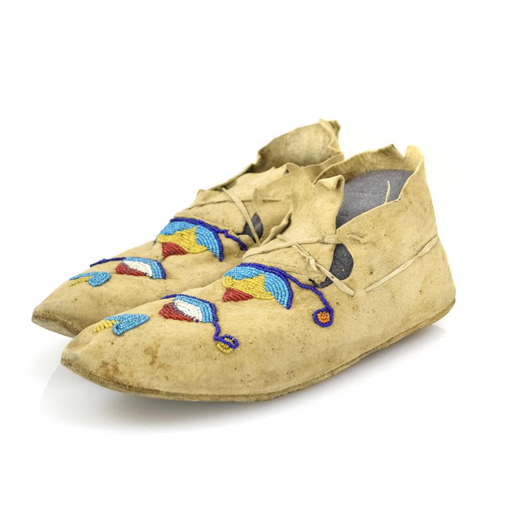 Plateau Beaded Moccasins with Corn Designs: c. 1890-1900s. Moccasins stand 3.75" tall, have a width of 3.25" and a depth of 10". Acquired from a private collection out of Minnesota. The owner inherited this from her mother, who travelled to the