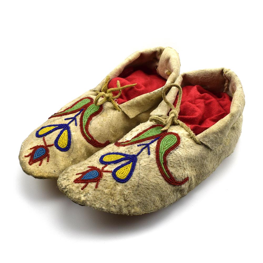 Plains Beaded Moccasins c. 1890s, 2.5" x 4" x 10": Sinew sewn. Acquired from a private collection in Sweden. The owner purchased these from a Native American antiques collector from Sweden, who traveled around the USA and Canada. He also collected ant