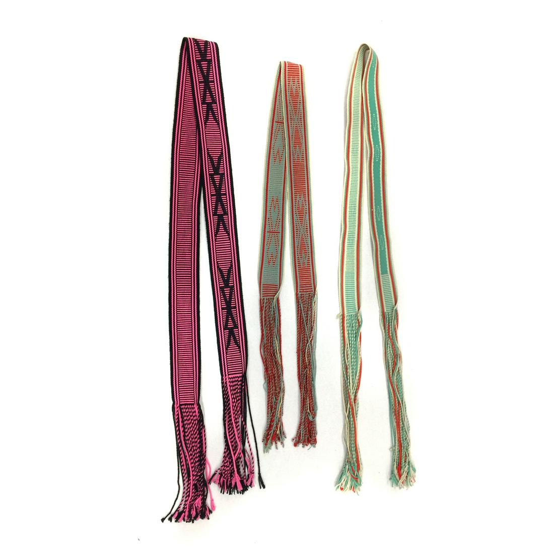 Group of 3 Navajo Sashes c. 1960-70s: The dark blue sash is 57" x 2.5" with a 19" fringe. The light blue sash is 50" x 2.75" with a 16" fringe. The pink sash is 74" x 3.5" with a 12" fringe. Acquired from a private collection in Arizona.