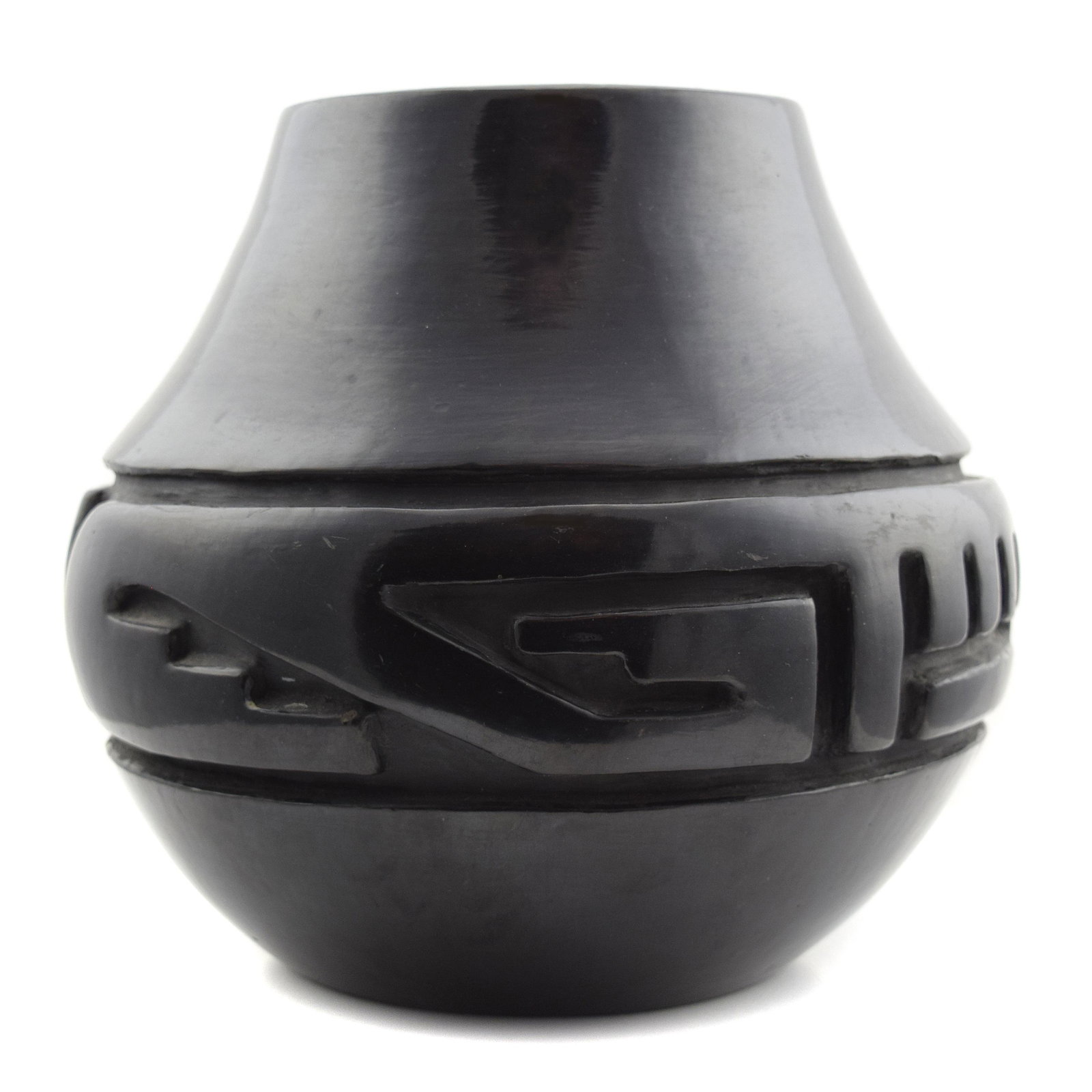Margaret Tafoya - Santa Clara Black Carved Vase: Margaret Tafoya (1904-2001) - Santa Clara Black Carved Vase c. 1950s, 8" x 8". This pottery is in near excellent condition, with only some minor surface wear. Signed "Margaret" on the bottom. This pot