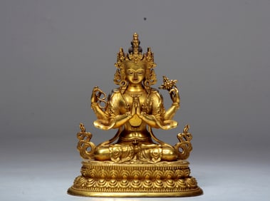 A GILT BRONZE FIGURE OF SEATED GUANYIN