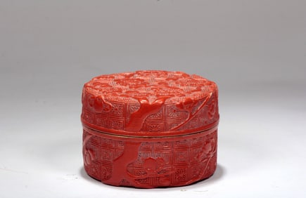 A RED GLAZED 'PLUM' BOX AND COVER