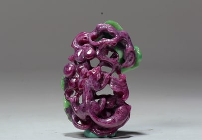 A RUBY AND SAPPHIRE 'SQUIRREL AND GRAPE' CARVING