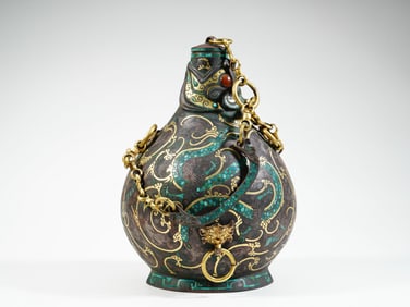 A GOLD INLAID BRONZE 'DRAGON AND PHOENIX'EWER