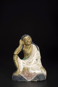 A STUCCO FIGURE OF ARHAT HVASHANG
