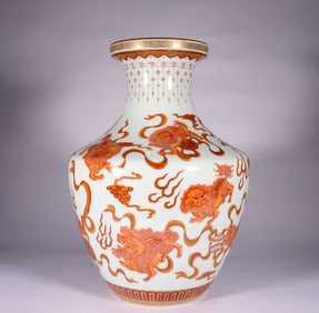 AN IRON RED 'LION' VASE