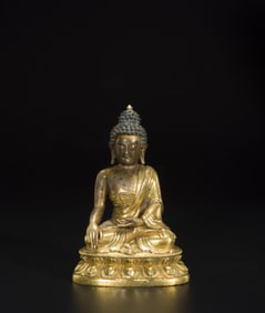 A GILT BRONZE FIGURE OF SHAKYAMUNI