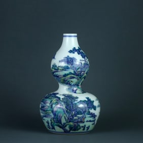 A DOUCAI 'LANDSCAPE' GOURD VASE
