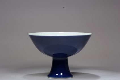 A BLUE STEMMED DISH