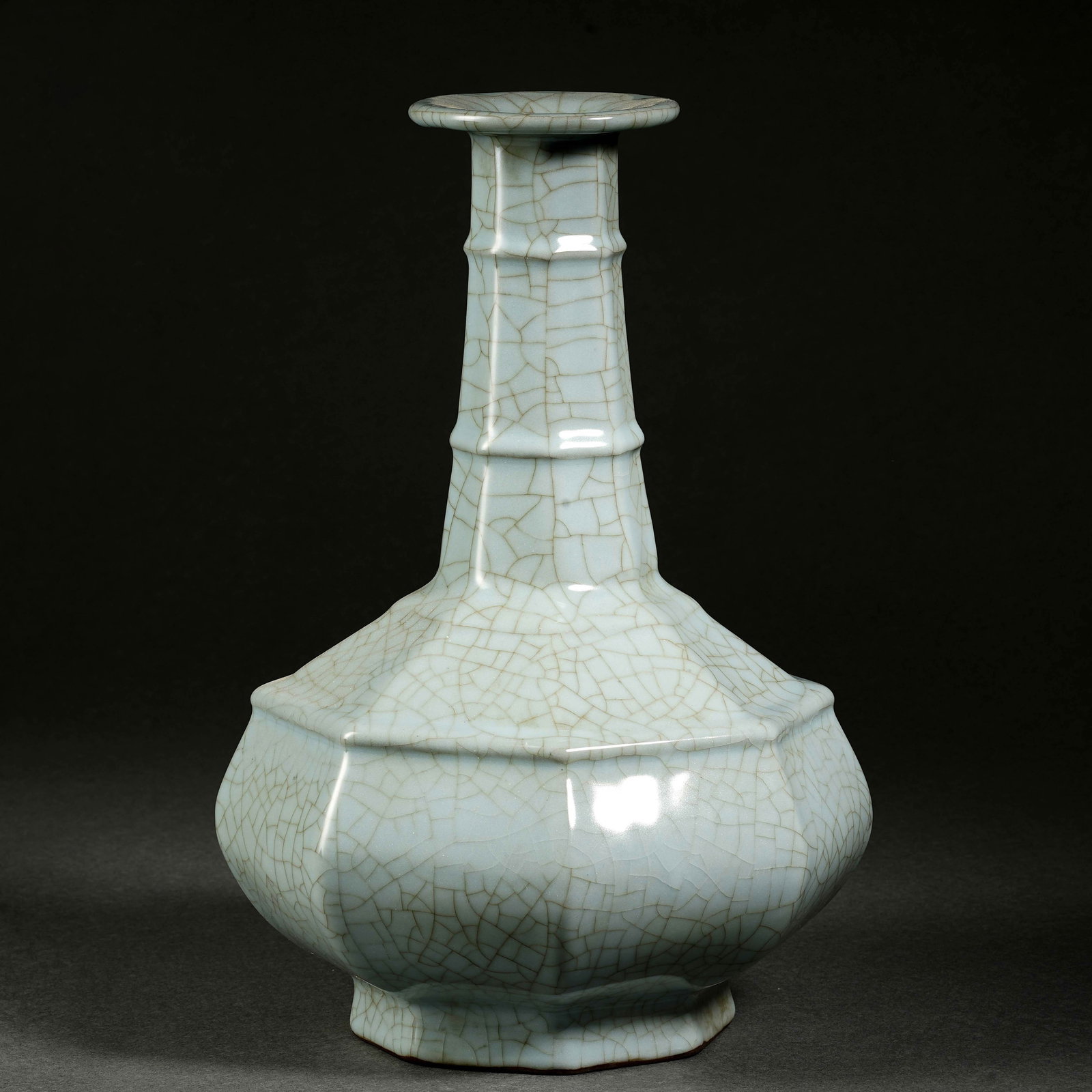 A Chinese pale celadon-glazed octagonal vase with string patterns and flared rim. (1 of 8)