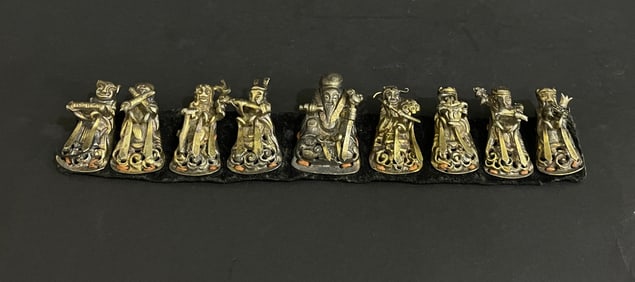 Group of Seven Silver Carved Character Pattern Ornament