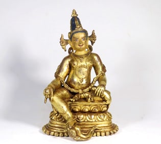 A GILT BRONZE FIGURE OF YELLOW JAMBHALA