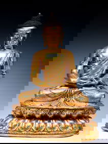 A GILT BRONZE FIGURE OF SEATED SHAKYAMUNI