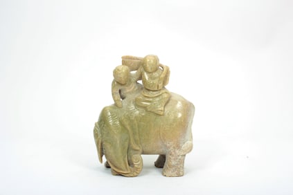 A JADE BOY RIDING ELEPHANT