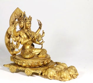 A GILT BRONZE FIGURE OF USNISAVIJAYA