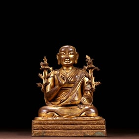 A GILT BRONZE FIGURE OF LAMA