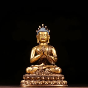 A GILT BRONZE FIGURE OF N?G?RJUNA