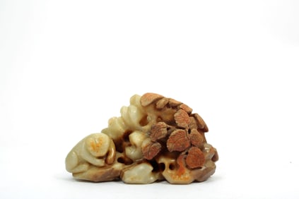 A JADE 'DOUBLE TIGER' ORNAMENT