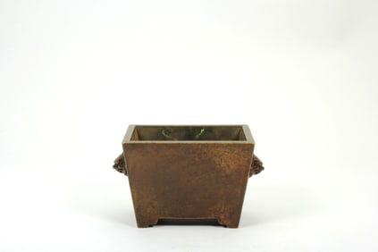 A BRONZE INCENSE RECTANGULAR BURNER