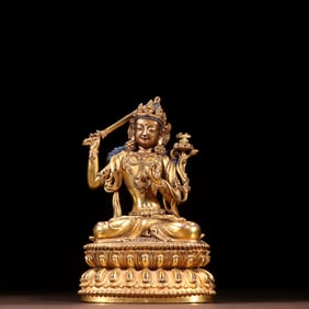 A GILT BRONZE FIGURE OF MANJUSHRI