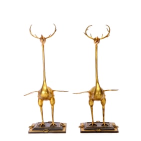 A GILT BRONZE PAIR OF 'MYTHICAL BEAST'ORNAMENTS