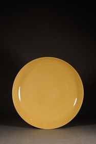 A YELLOW GLAZED DISH