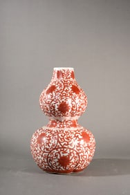 AN IRON RED 'LOTUS' LOBED VASE