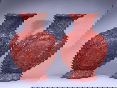 A PAIR OF CORAL RED VASES