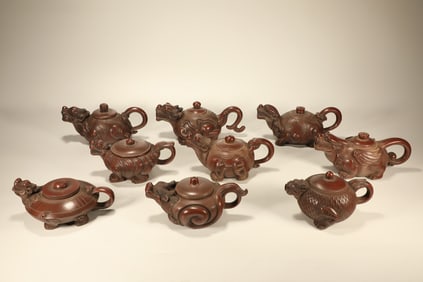 Group of Nine Purple Clay Carved Dragon Shape Teapot