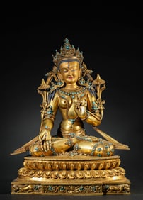 A Tibetan Dansatil Style Turquoise-Inlaid White Tara Statue