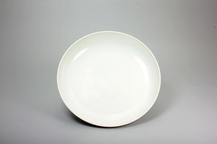 A WHITE GLAZED DISH