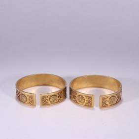 Pair of Gilt Silver Carved Shou Pattern Bangle