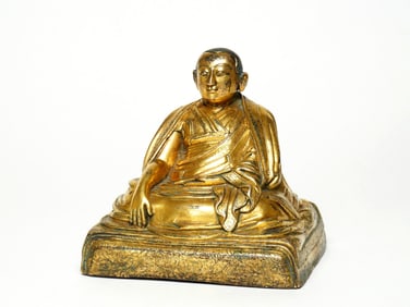 A GILT BRONZE FIGURE OF MAITREYA-BUDDHA