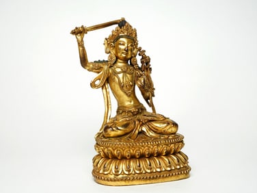 A GILT BRONZE FIGURE OF MANJUSHRI