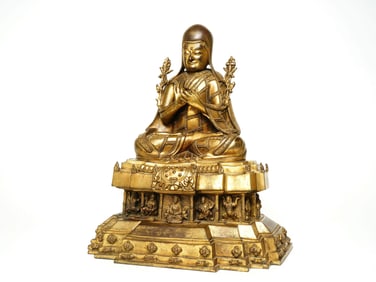 A GILT BRONZE FIGURE OF BUDDA