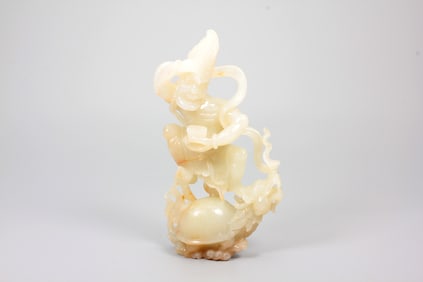 A HETIAN JADE IMMORTAL ORNAMENT