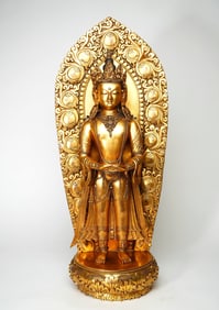 A GILT BRONZE FIGURE OF BUDDA