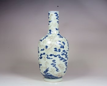 A BLUE AND WHITE RED GLAZED 'DRAGON' MALLET VASE