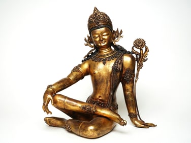 A GILT BRONZE FIGURE OF GUANYIN
