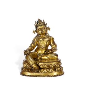 A GILT BRONZE FIGURE OF JAMBHALA