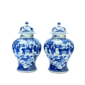 A PAIR OF BLUE AND WHITE 'FIGURAL'JARS AND COVERS
