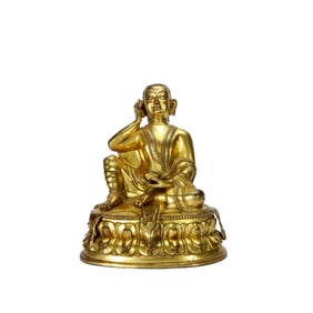 A GILT BRONZE FIGURE OF MILAREPA
