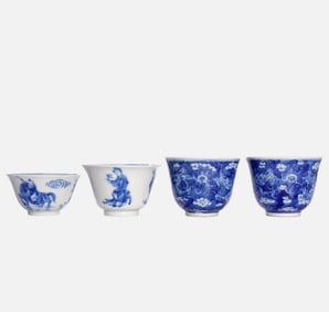 A BLUE AND WHITE 'FIGURAL AND DRAGON'CUPS