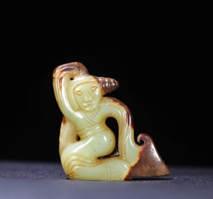 A HETIAN JADE DANCING FIGURE